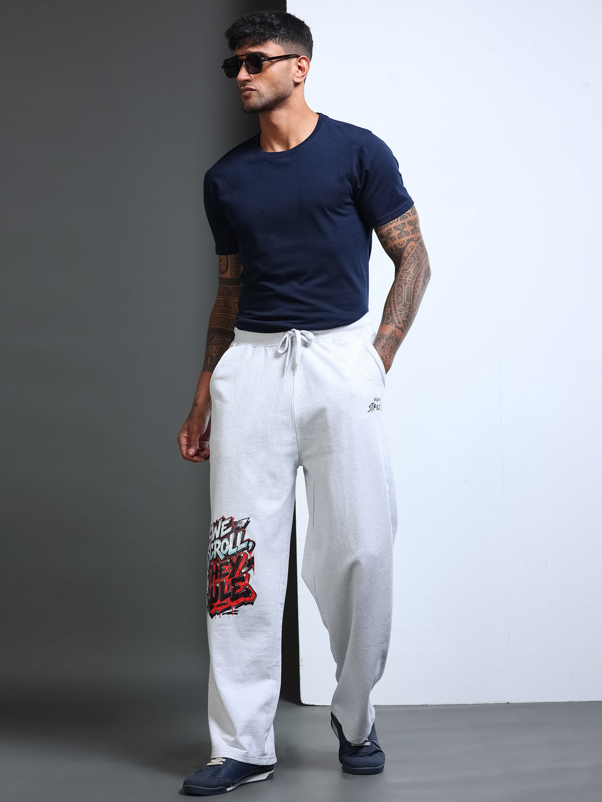 ARDEUR STREETZ Men White Melange Cotton Blend WE SCROLL THEY RULE Printed Baggy Fit Track Pants